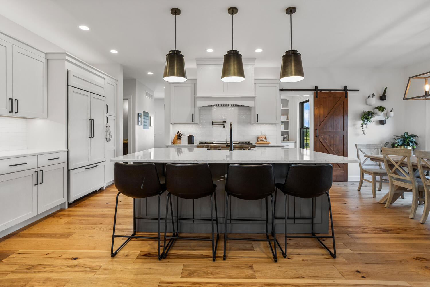 1335 2250 East St. Joseph, IL 61873 - Photo 13 of 68 a kitchen with stainless steel appliances kitchen island granite countertop a dining table chairs and sink