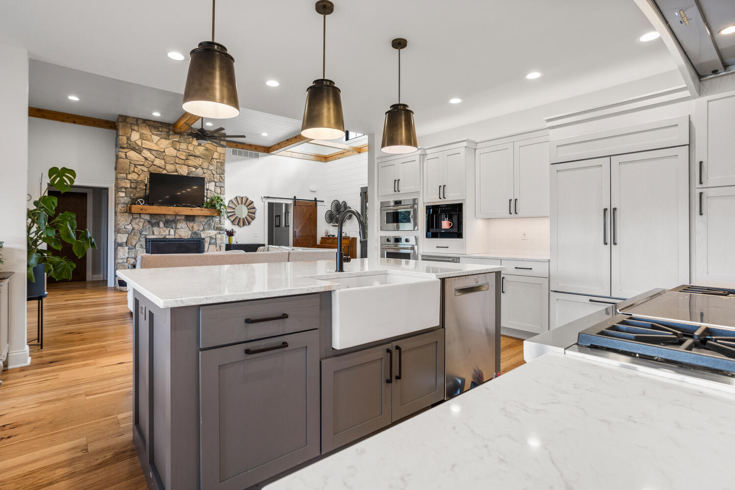 1335 2250 East St. Joseph, IL 61873 - Photo 15 of 68 a kitchen with stainless steel appliances kitchen island granite countertop a sink a stove and a wooden floors