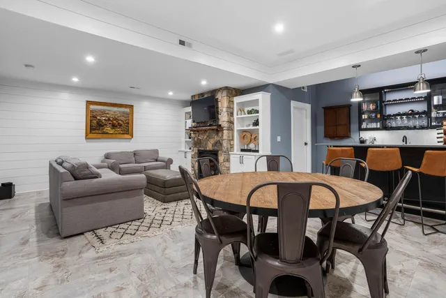 a bathroom with a bathtub shower sink vanity and a mirror