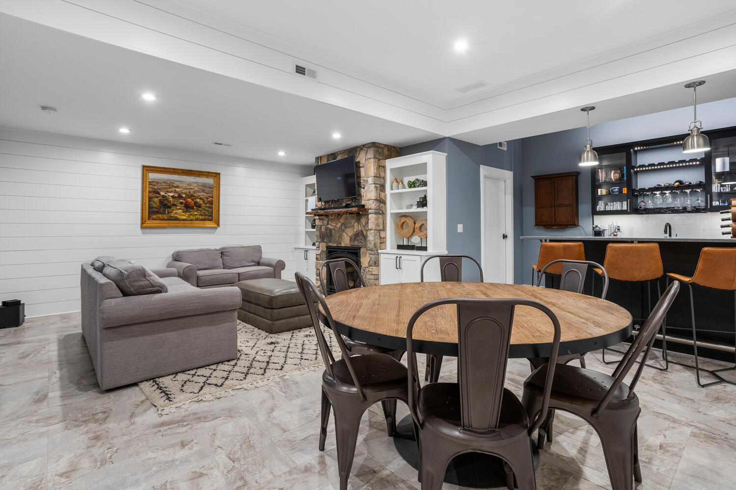 1335 2250 East St. Joseph, IL 61873 - Photo 31 of 68 a living room with furniture a flat screen tv and kitchen view