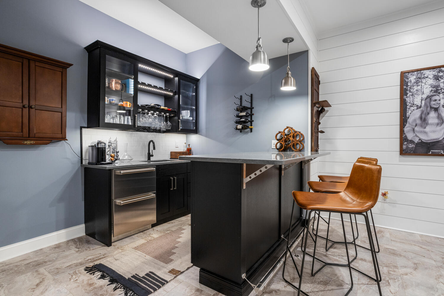 1335 2250 East St. Joseph, IL 61873 - Photo 32 of 68 a living room with stainless steel appliances kitchen island granite countertop furniture and a wooden floor
