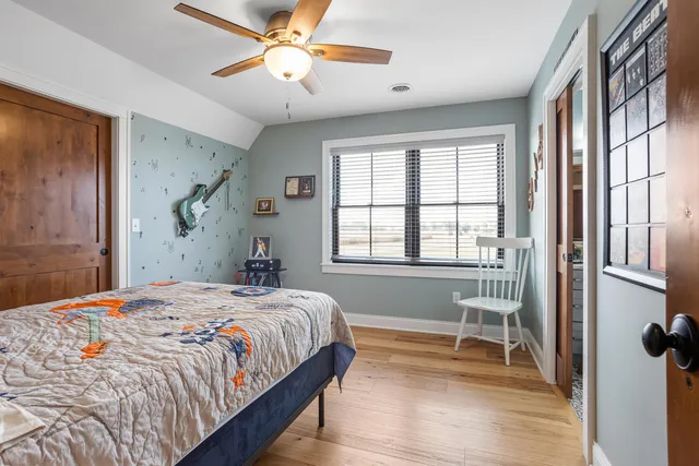 a bedroom with a bed and a table in it