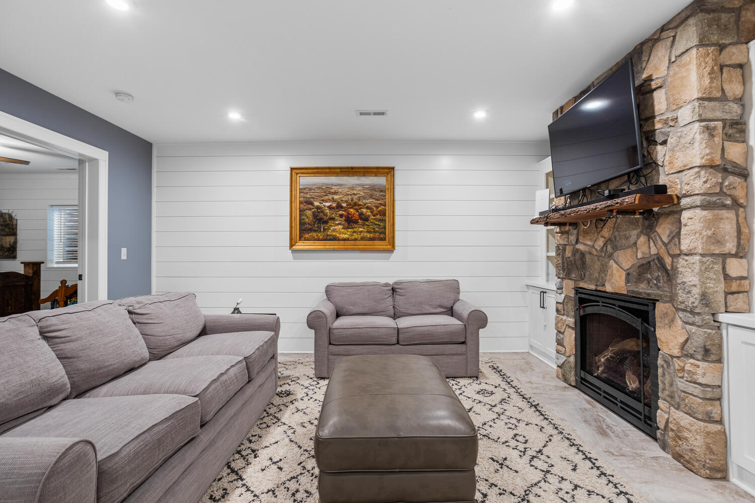 1335 2250 East St. Joseph, IL 61873 - Photo 46 of 68 a living room with furniture a flat screen tv and a fireplace