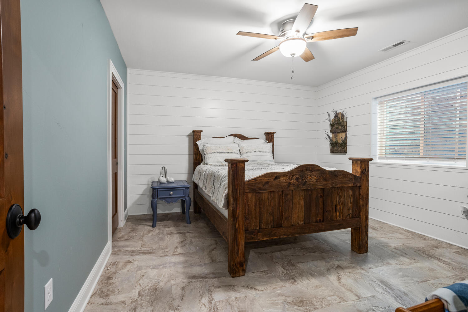 1335 2250 East St. Joseph, IL 61873 - Photo 47 of 68 a bedroom with a bed and a chandelier