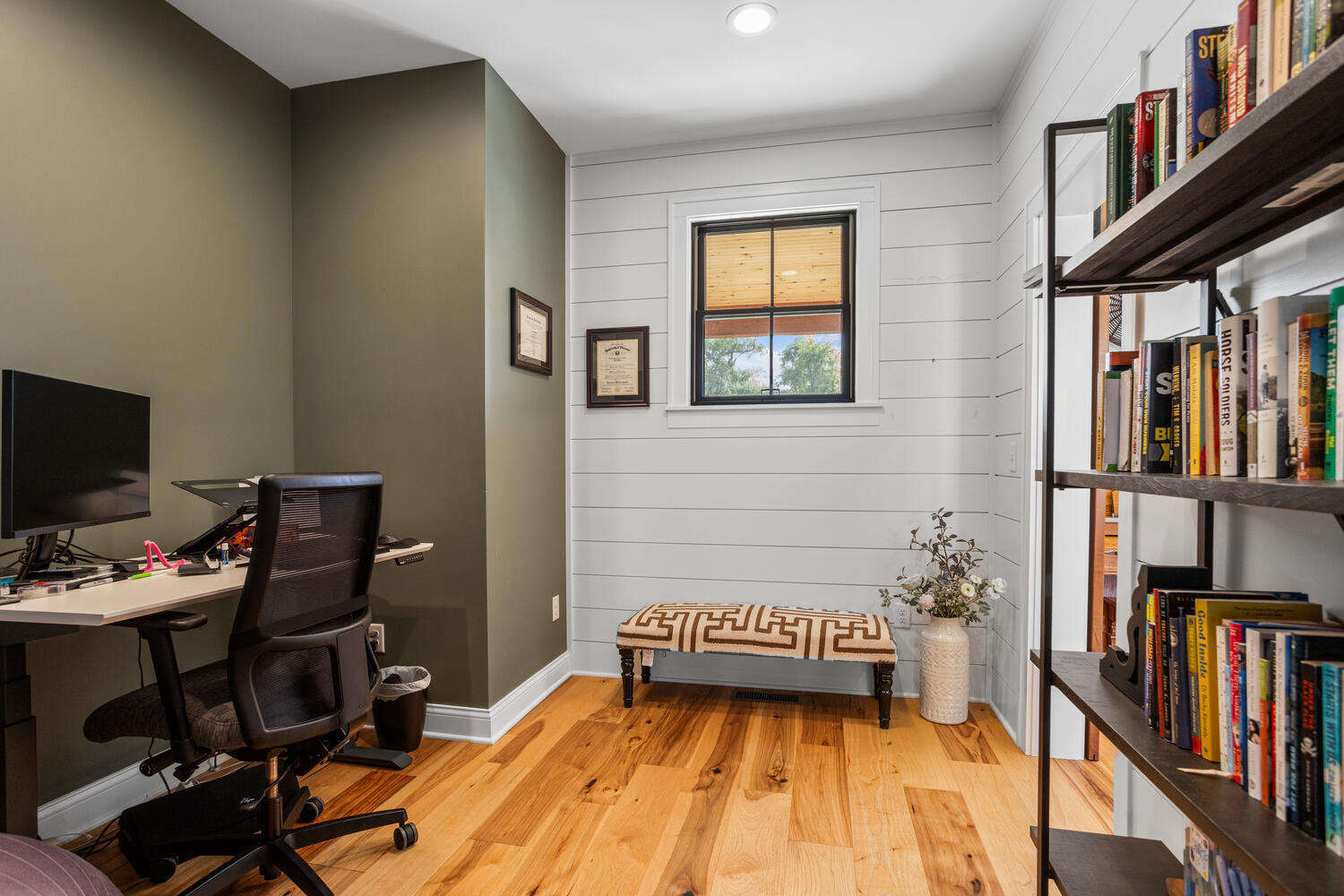1335 2250 East St. Joseph, IL 61873 - Photo 50 of 68 a bedroom with a bed and a book shelf