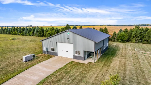 a living room with hard wood flooring and a table