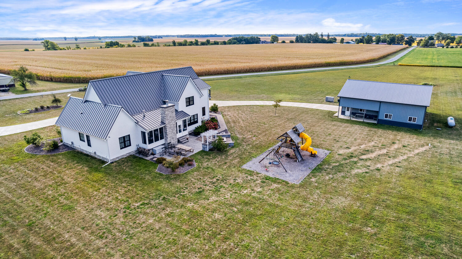 1335 2250 East St. Joseph, IL 61873 - Photo 60 of 68 an aerial view of a house with a garden and lake view