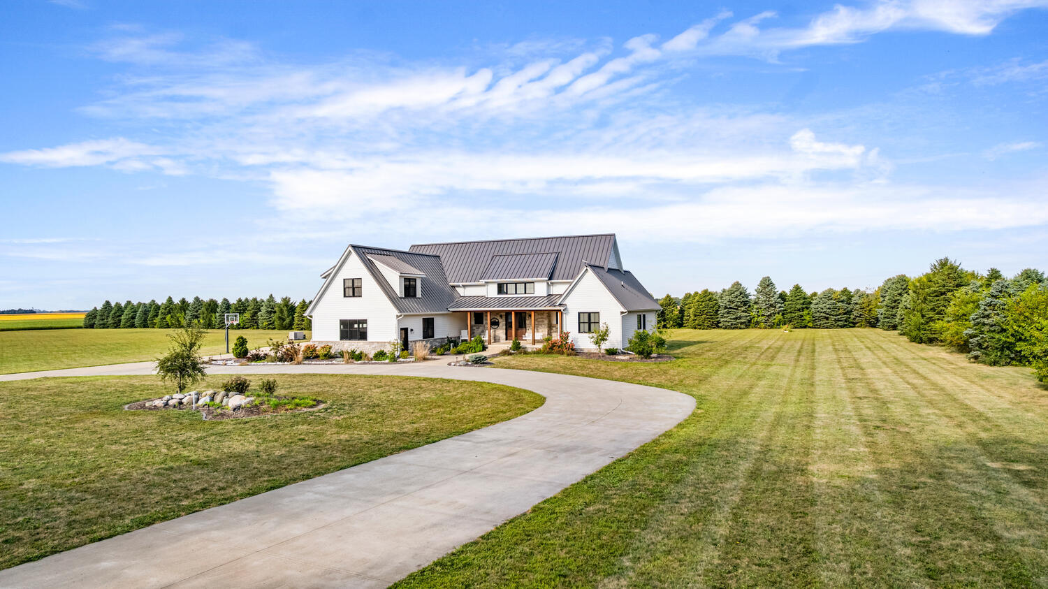 1335 2250 East St. Joseph, IL 61873 - Photo 62 of 68 a view of a house with a big yard and large trees