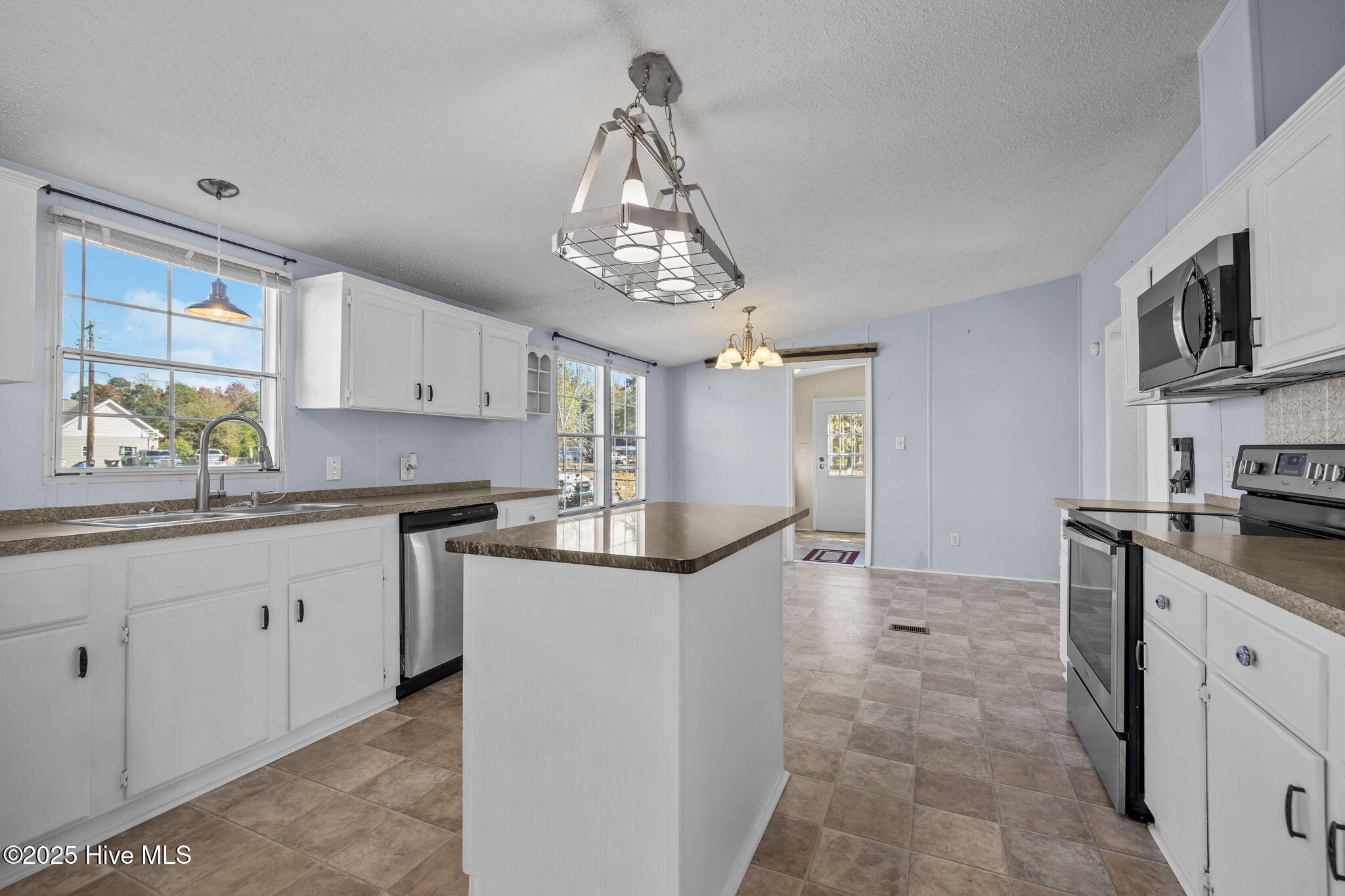 758 Wetherington Landing Road Stella, NC 28582 - Photo 13 of 49 Island has granite countertop