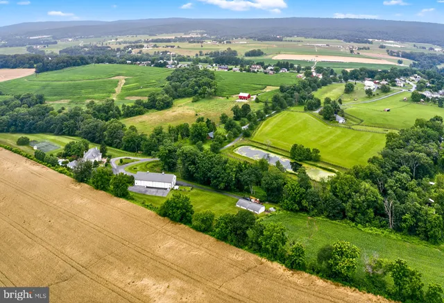 a kitchen with stainless steel appliances granite countertop a stove and a refrigerator