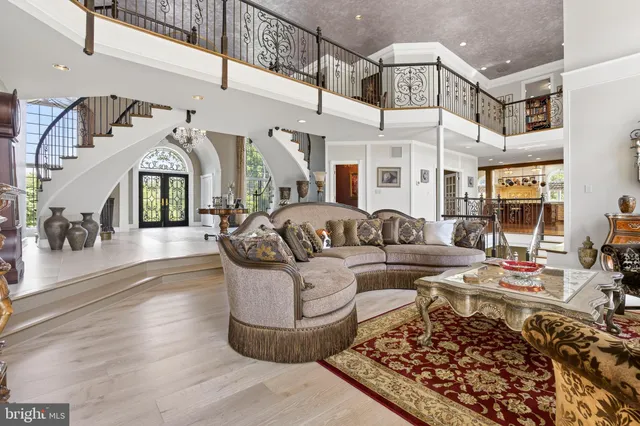 a living room with furniture and a gym machine