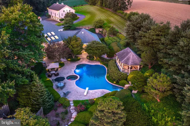 an aerial view of residential houses with outdoor space