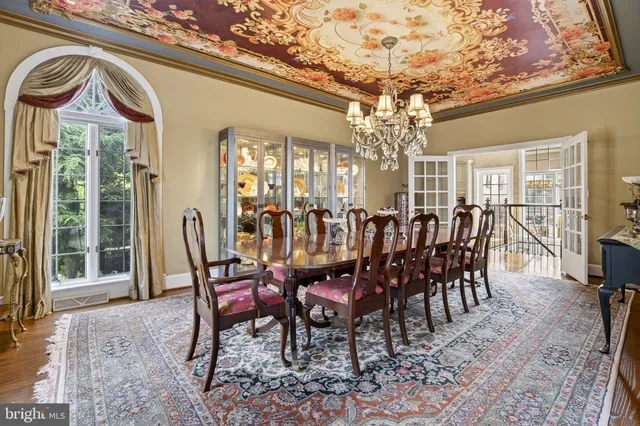 an aerial view of residential houses with outdoor space and swimming pool