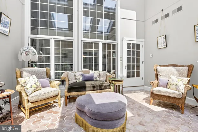 a bathroom with a toilet and a mirror