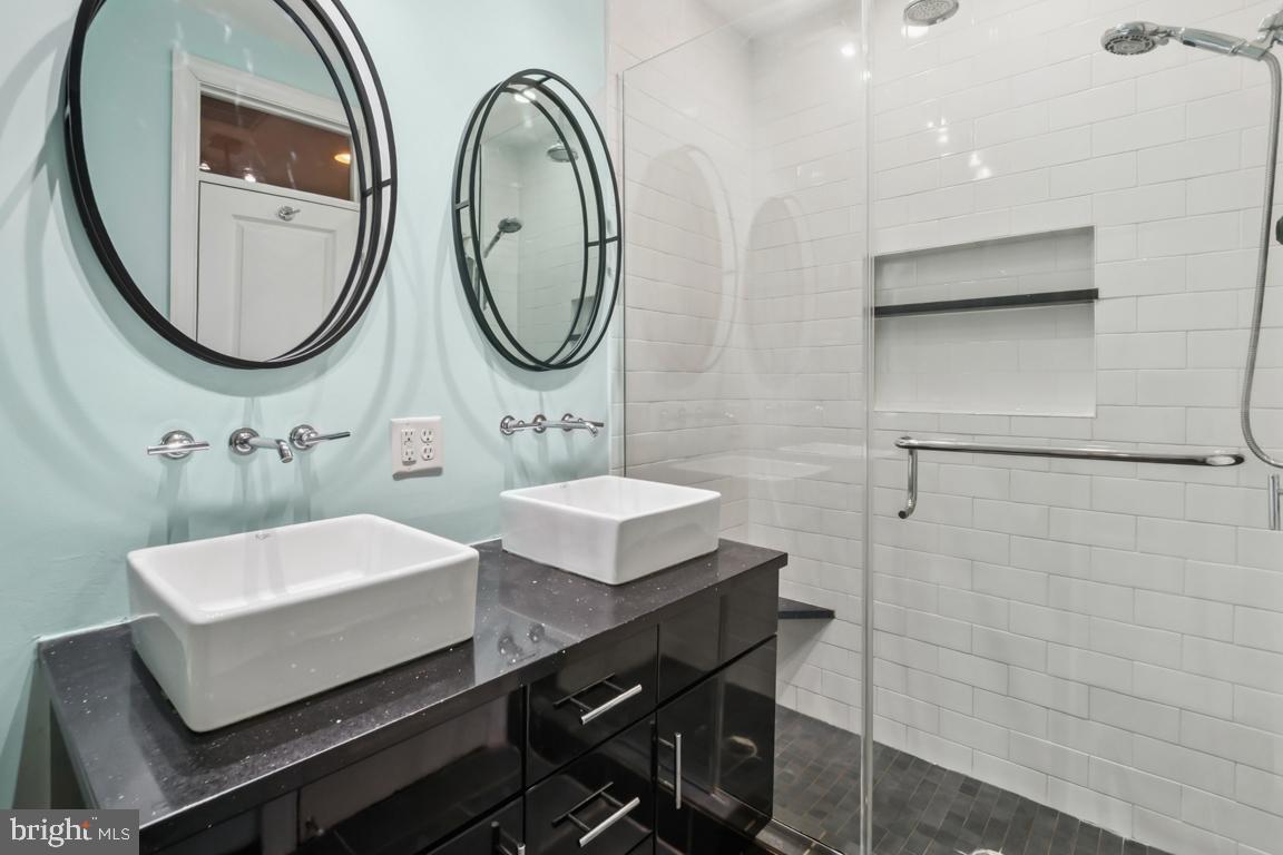 121 South Curley Street Baltimore, MD 21224 - Photo 25 of 40 Sleek modern bathroom with dual sinks.