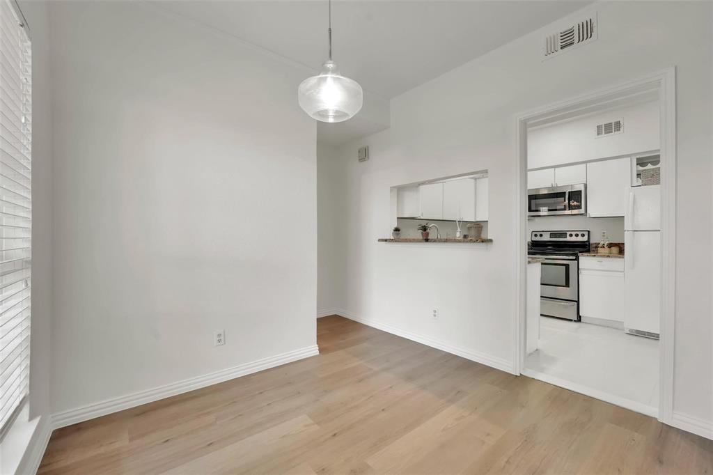 1700 Amelia Court, Unit 312 Plano, TX 75075 - Photo 11 of 30 a view of kitchen with wooden floor