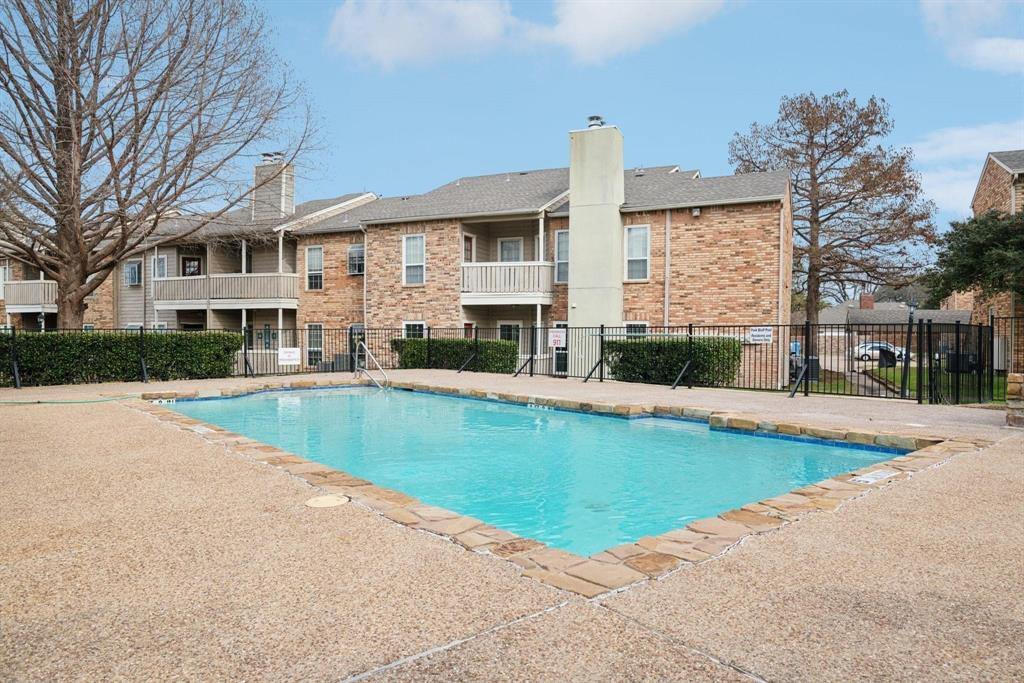 1700 Amelia Court, Unit 312 Plano, TX 75075 - Photo 30 of 30 a view of pool with outdoor seating and house in the background