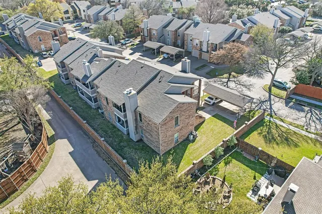 an aerial view of a house with a garden and plants