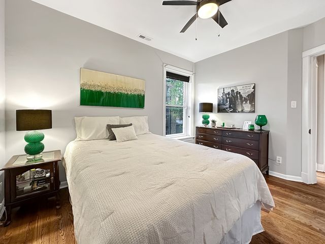 a bedroom with a bed and a tv