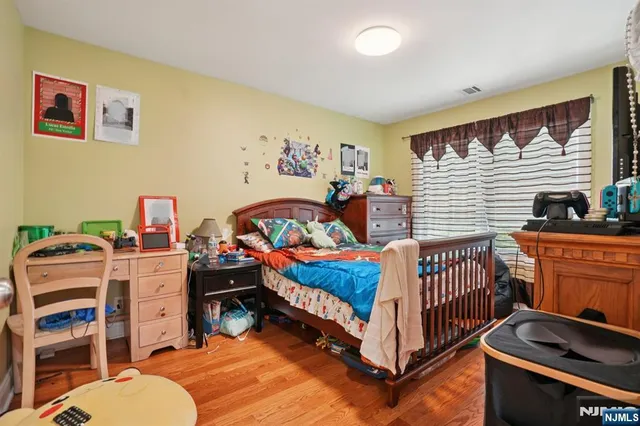 a bedroom with bed and a window