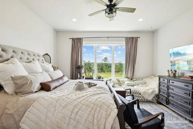 a bed room with a bed and a chair