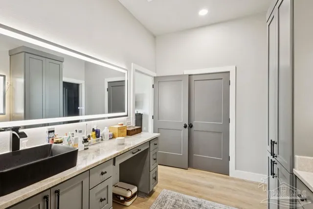 a bathroom with a sink and a mirror