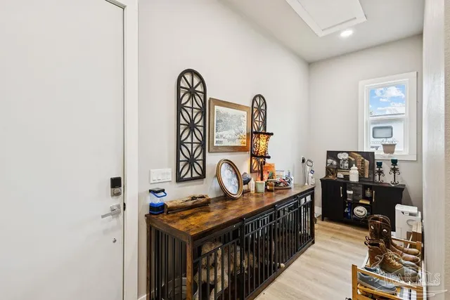 a view of a hallway with seating area