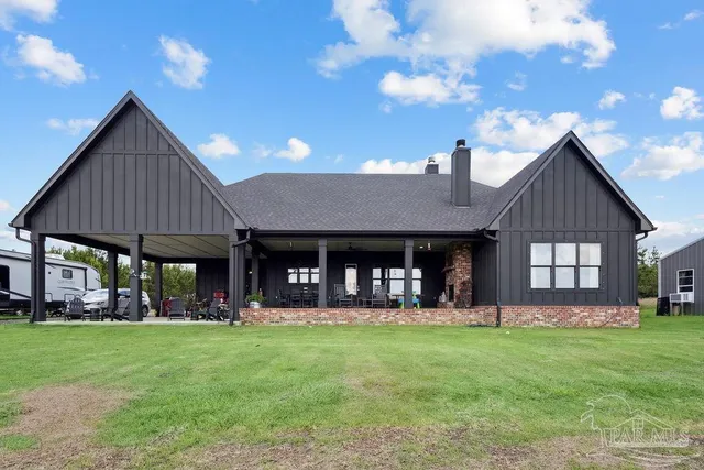 a backyard of a house with lots of green space