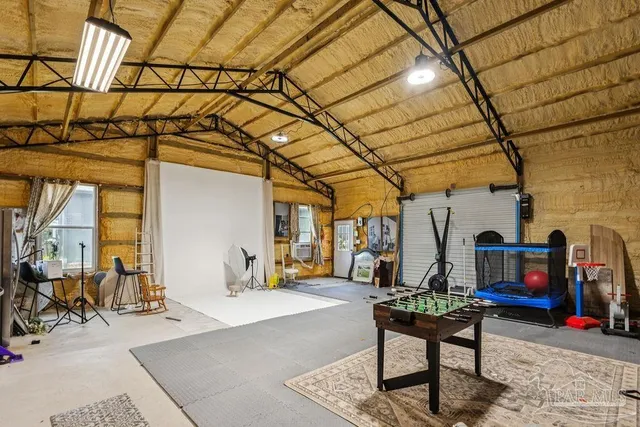 a backyard of a house with table and chairs