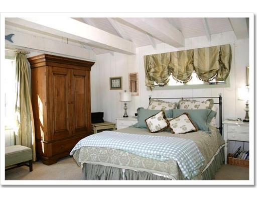 13 Short Street Cohasset, MA 02025 - Photo 18 of 20 a bedroom with a bed and a mirror