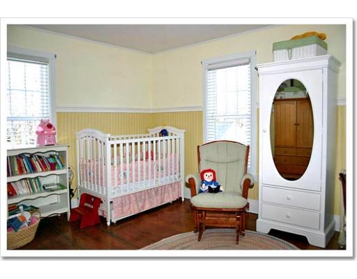 13 Short Street Cohasset, MA 02025 - Photo 19 of 20 a living room with furniture and a baby crib