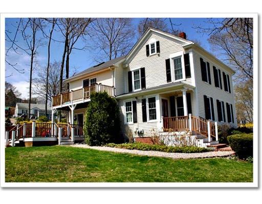 13 Short Street Cohasset, MA 02025 - Photo 3 of 20 a front view of a house with a yard