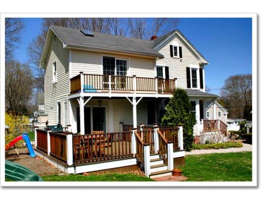 13 Short Street Cohasset, MA 02025 - Photo 5 of 20 a front view of a house with garden