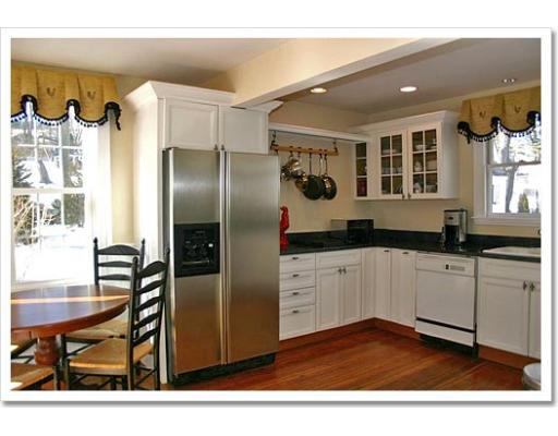 13 Short Street Cohasset, MA 02025 - Photo 9 of 20 a kitchen with stainless steel appliances granite countertop a refrigerator and a stove top oven