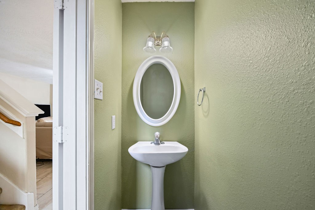19731 Village Ridge Drive Tomball, TX 77375 - Photo 12 of 23 a bathroom with a sink and a mirror
