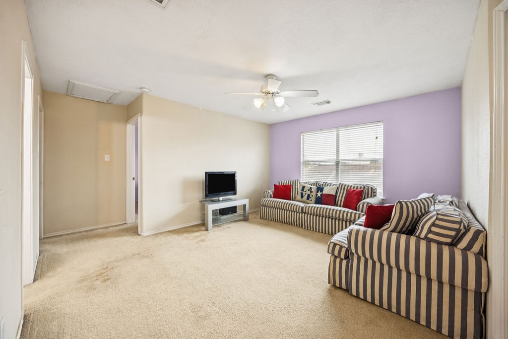 19731 Village Ridge Drive Tomball, TX 77375 - Photo 15 of 23 a living room with furniture and a window