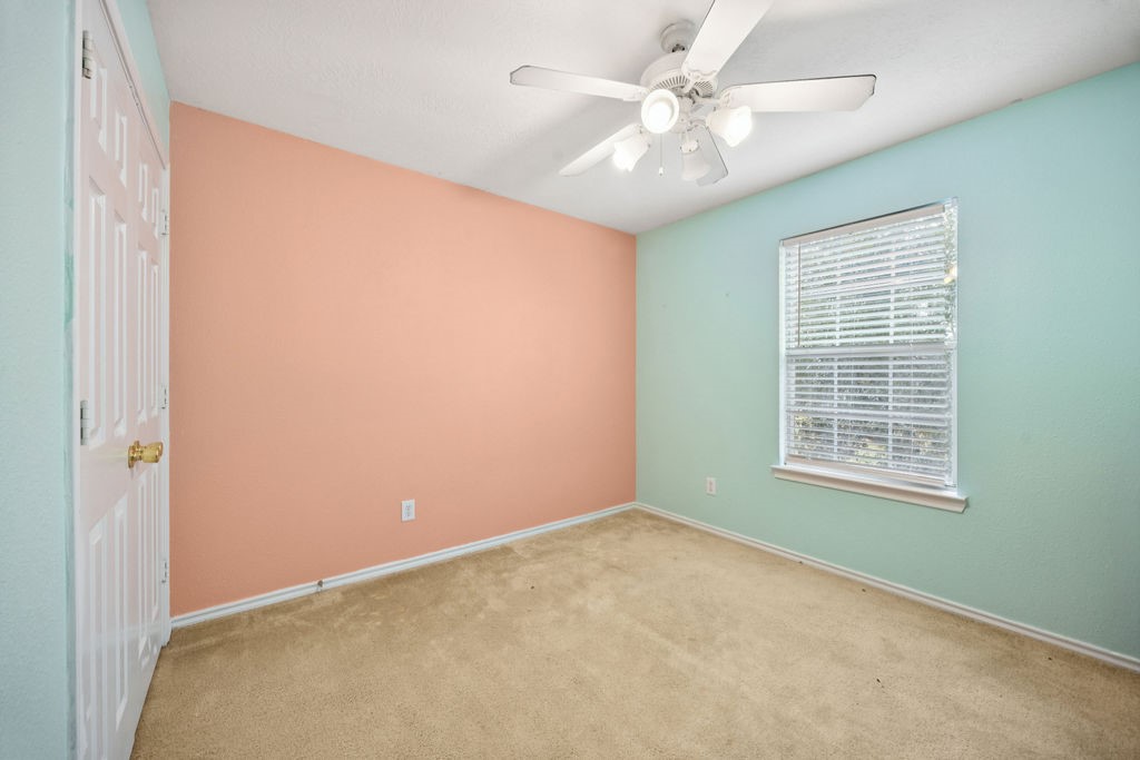 19731 Village Ridge Drive Tomball, TX 77375 - Photo 16 of 23 an empty room with a window and a fan