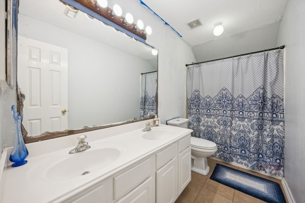 19731 Village Ridge Drive Tomball, TX 77375 - Photo 17 of 23 a bathroom with a sink toilet and shower