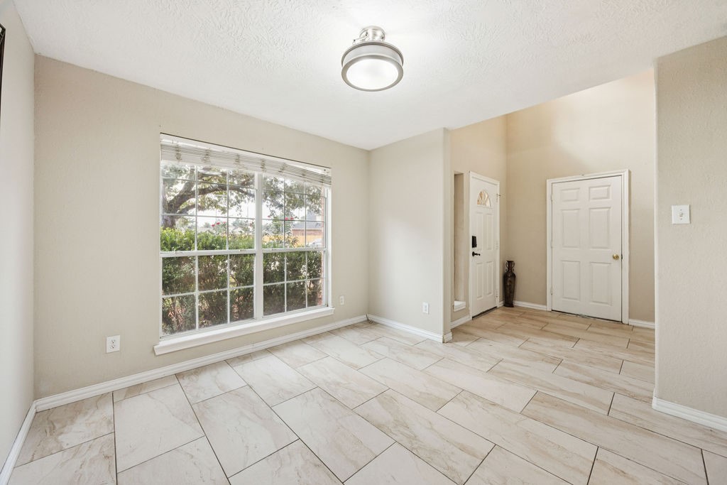 19731 Village Ridge Drive Tomball, TX 77375 - Photo 3 of 23 a view of empty room with windows