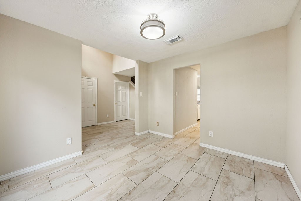 19731 Village Ridge Drive Tomball, TX 77375 - Photo 4 of 23 a view of a room with wooden floor and white walls