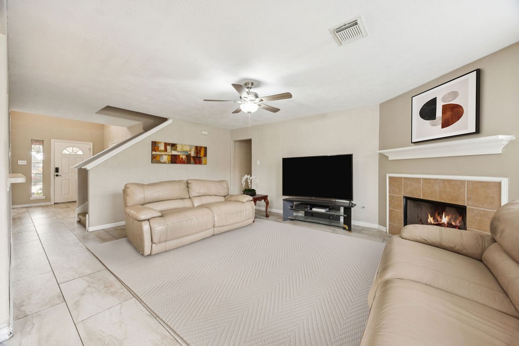19731 Village Ridge Drive Tomball, TX 77375 - Photo 5 of 23 a living room with furniture and a flat screen tv