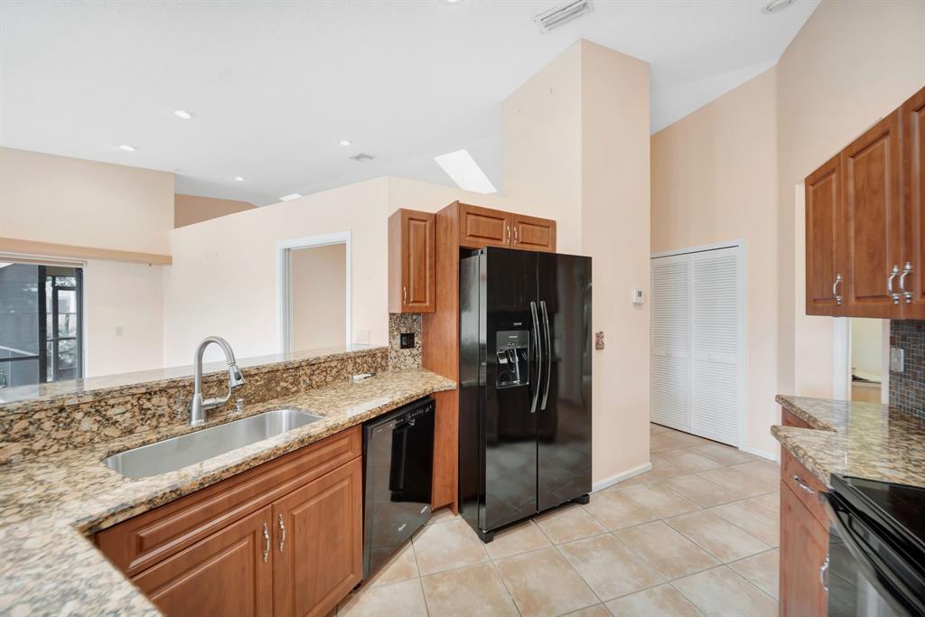 8507 Northwest 83rd Street Tamarac, FL 33321 - Photo 14 of 45 Open Kitchen With Elevated Ceiling