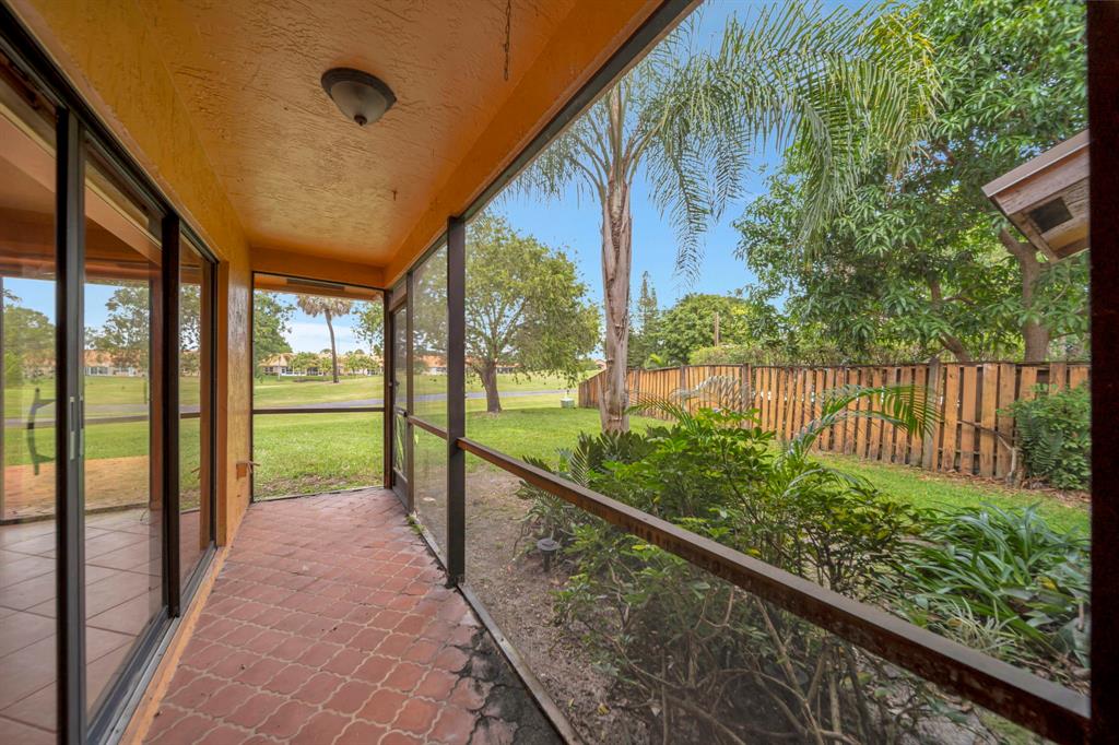 8507 Northwest 83rd Street Tamarac, FL 33321 - Photo 31 of 45 Screened Porch With Golf Course View