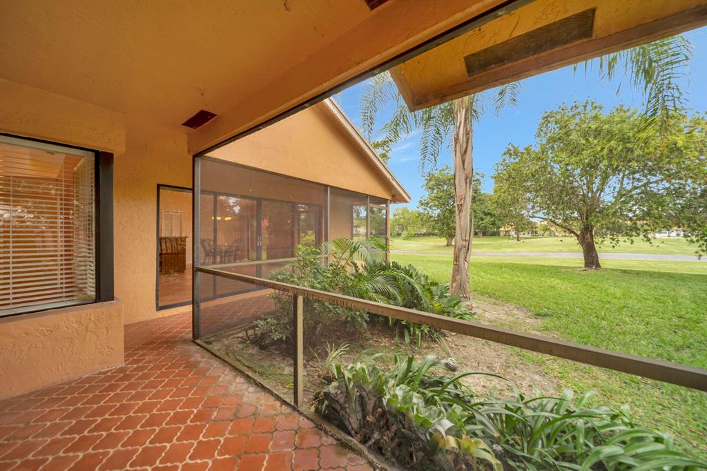 8507 Northwest 83rd Street Tamarac, FL 33321 - Photo 32 of 45 Screened Porch With Golf Course View