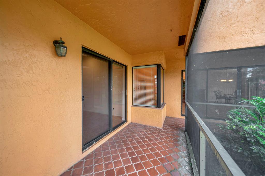 8507 Northwest 83rd Street Tamarac, FL 33321 - Photo 33 of 45 Screened Porch & Master Bedroom Entry