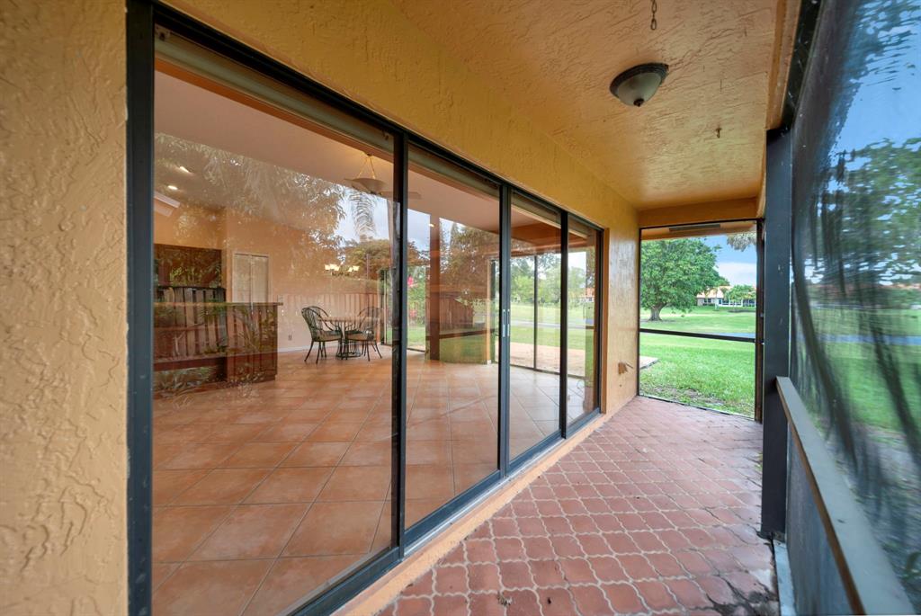 8507 Northwest 83rd Street Tamarac, FL 33321 - Photo 35 of 45 Screened Porch & Family Room Entry