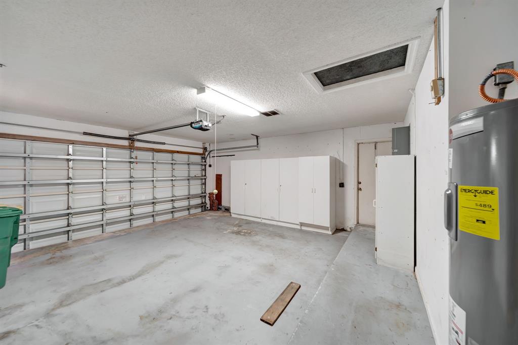 8507 Northwest 83rd Street Tamarac, FL 33321 - Photo 36 of 45 Two Car Garage With Storage Cabinets