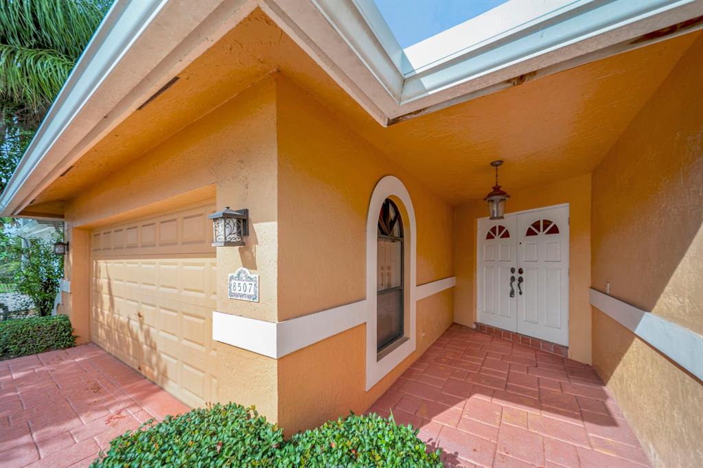 8507 Northwest 83rd Street Tamarac, FL 33321 - Photo 5 of 45 Front Door Covered Entry