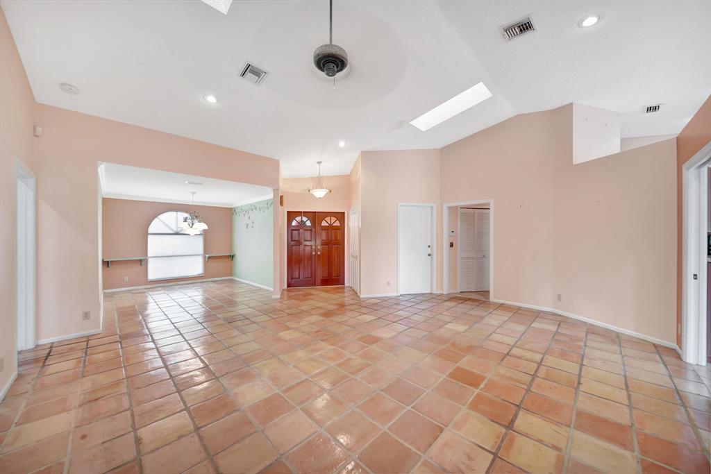 8507 Northwest 83rd Street Tamarac, FL 33321 - Photo 7 of 45 Grand Living Room - Dining Room area with Elevated Ceiling & Skylights!