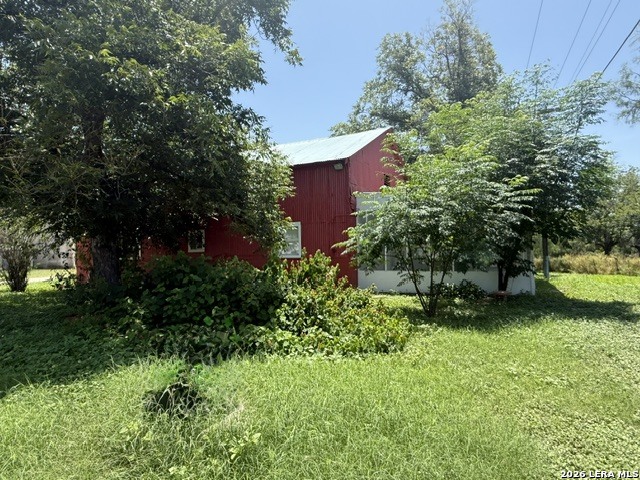 470 Weyrich Road Eagle Pass, TX 78852 - Photo 3 of 8 a view of a backyard with plants and a bench